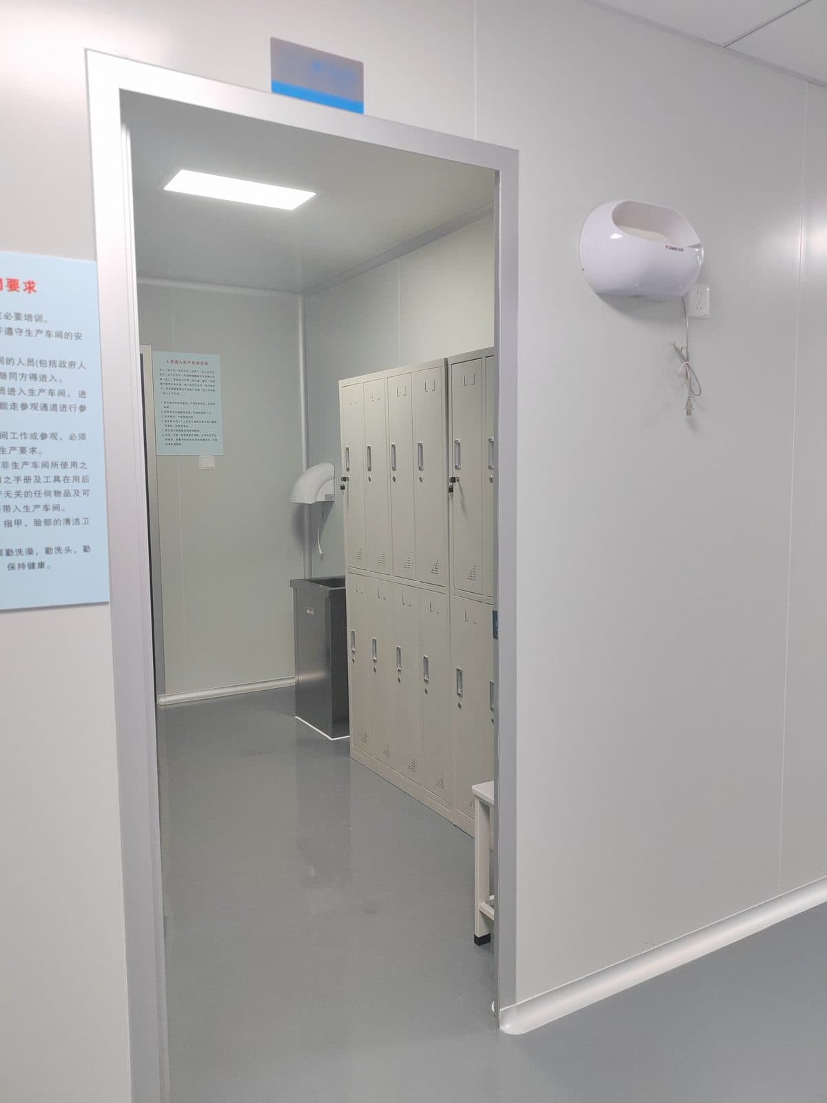 Gowning room with lockers where staff change into clean garments before aspirator assembly
